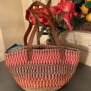 HANDWOVEN Kenyan Sisal fiber market tote, TAN leather straps, colorful pattern.